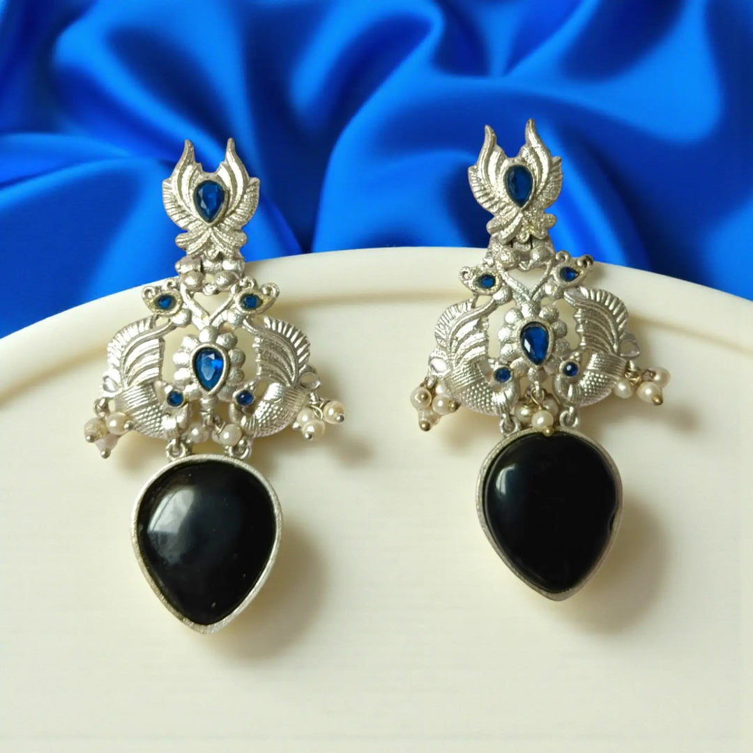 Gyada oxidised silver dangler earrings in black — bold night wear, fusion style, and elegant evening occasions.
