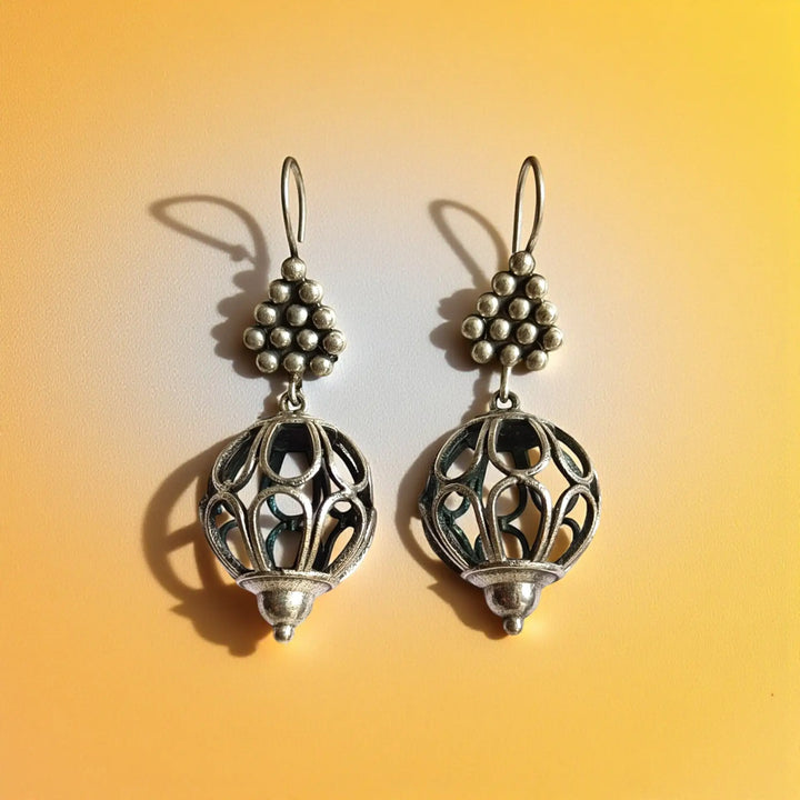 Close up of Sanyukta silver plated hook earrings showing antique detailing – handcrafted ethnic jewellery by Tela Naari
