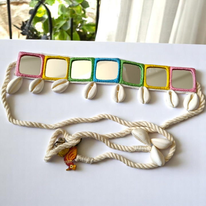 Shell charms decorate the surface of this colourful fabric choker.