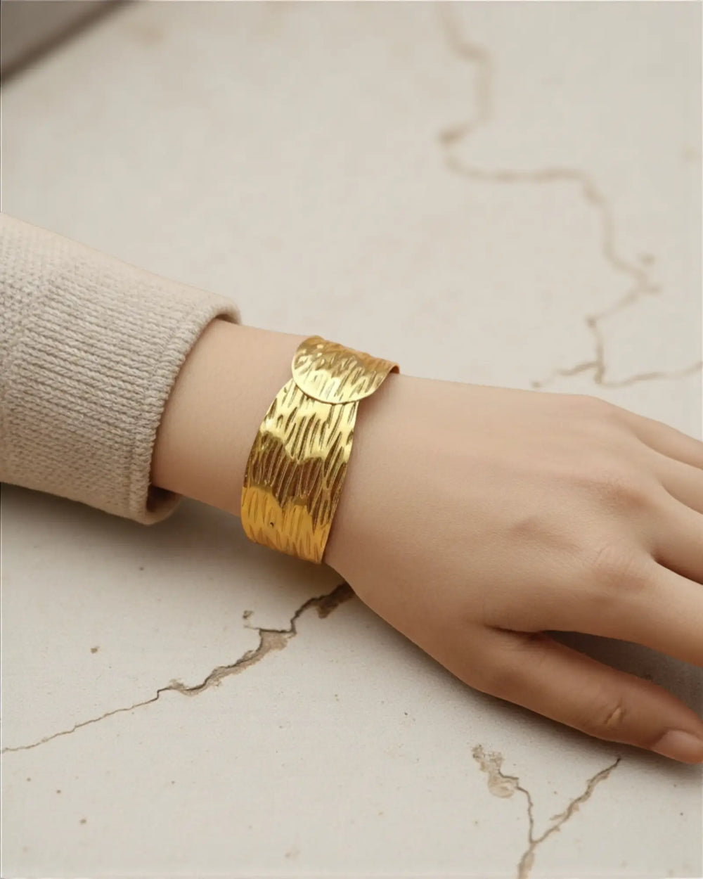 Anti-tarnish coating keeps this crinkle cuff radiant without polishing.