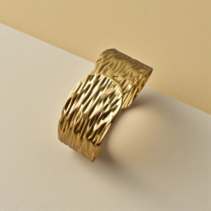 Playful dimension defines the crinkled pattern across this cuff surface.