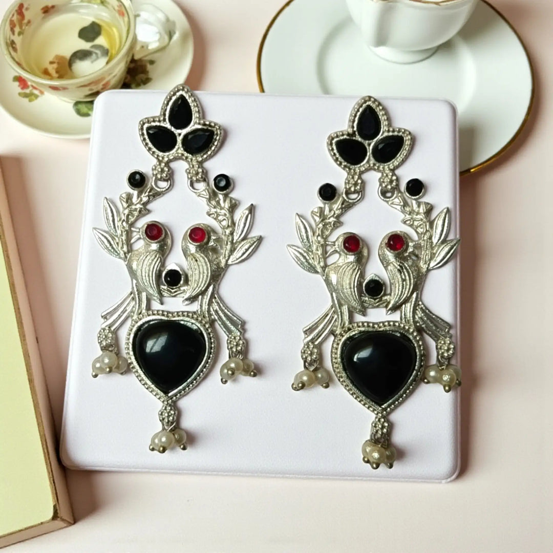 Sleek oxidised finish gives this earring its effortless ethnic charm.