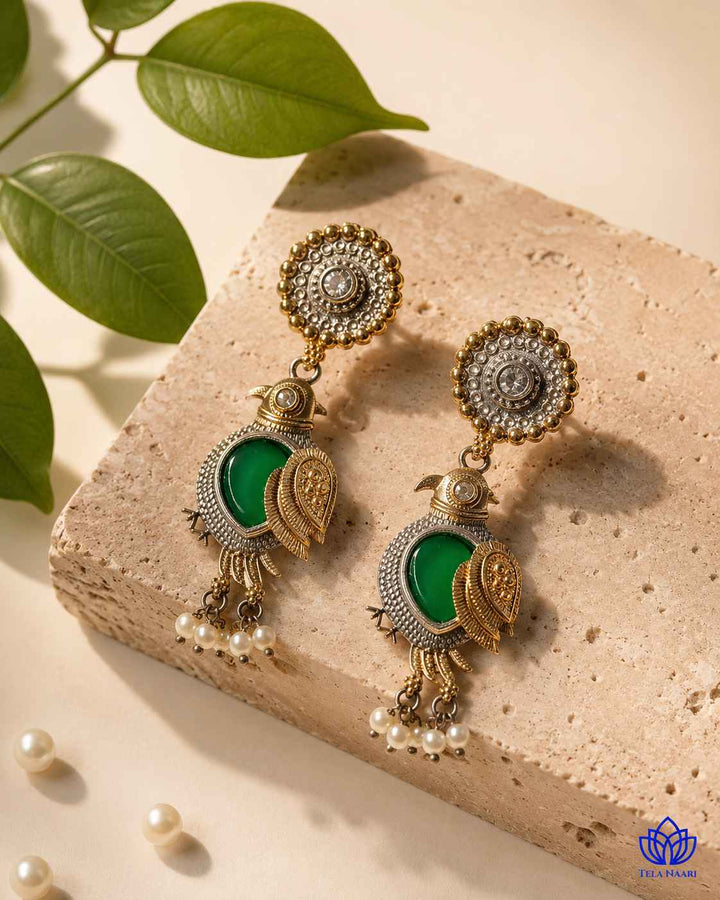 Bird motif pairs with delicate pearl accents in this earring.