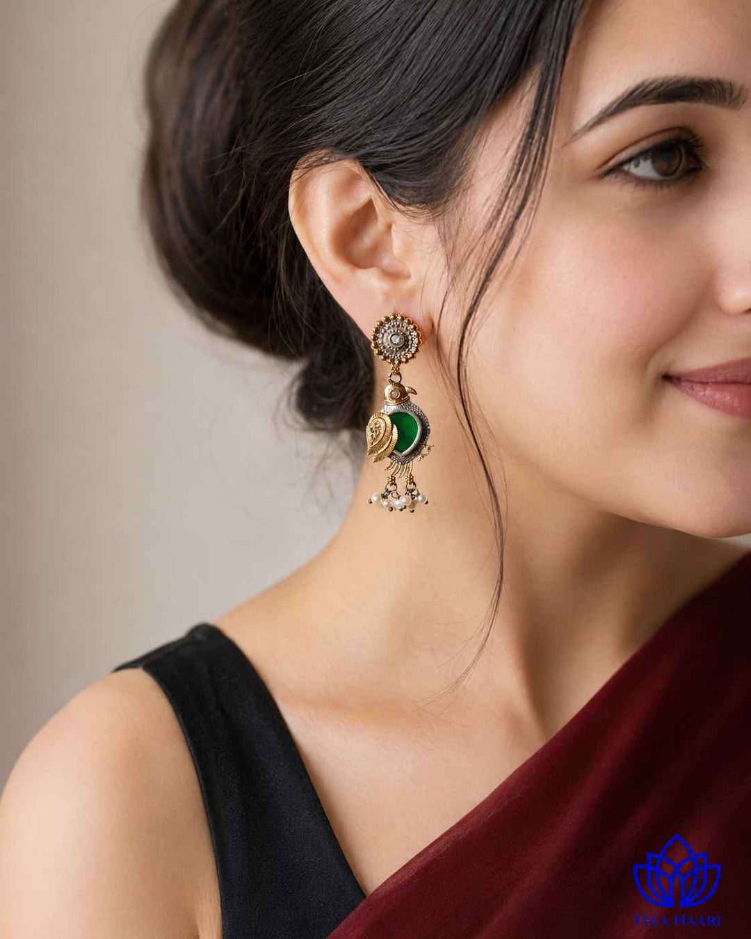Dual-tone plating gives this earring a layered metallic finish.