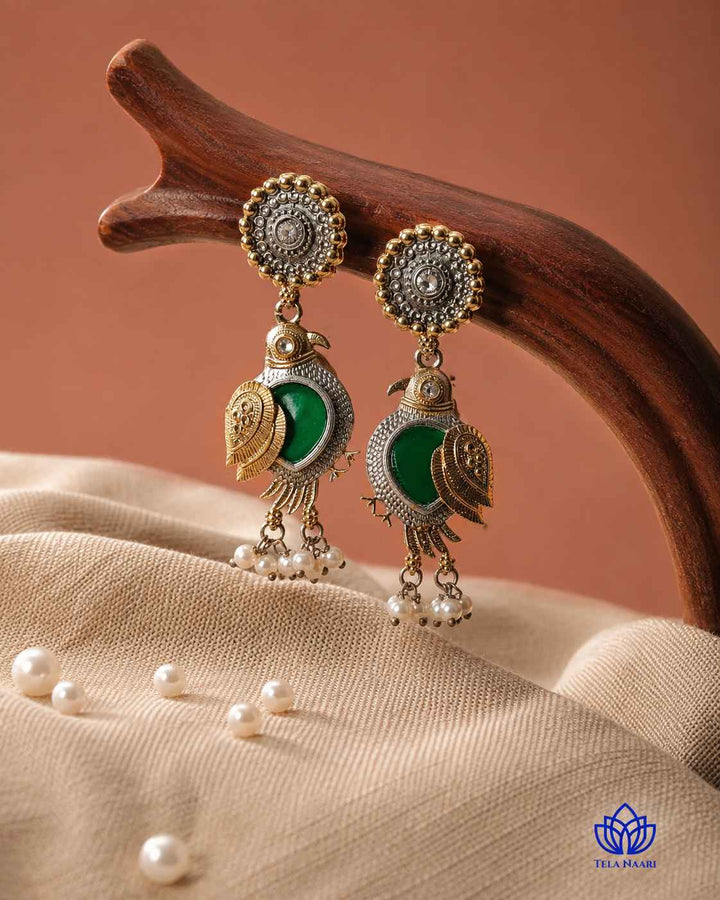 Delicate detailing shapes the bird motif on this earring surface.