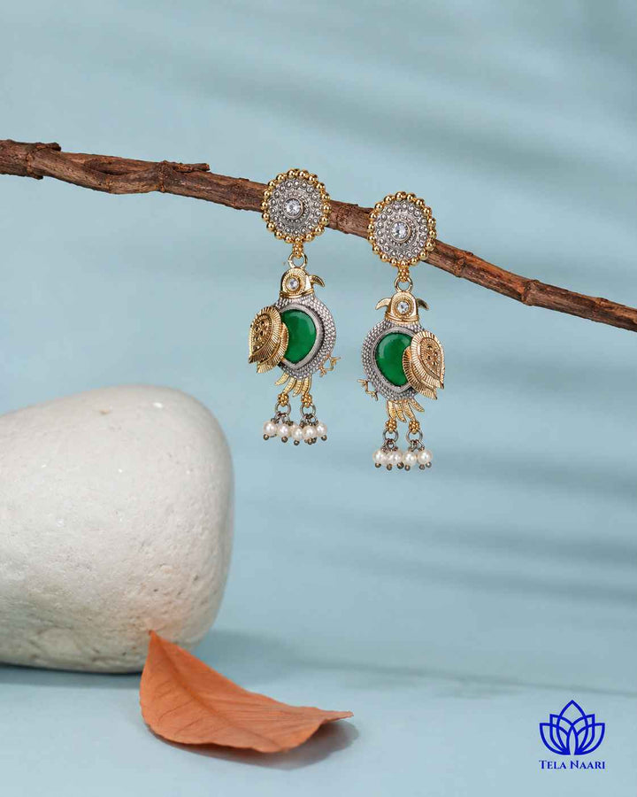 Lightweight build makes this dual-tone earring easy to wear.