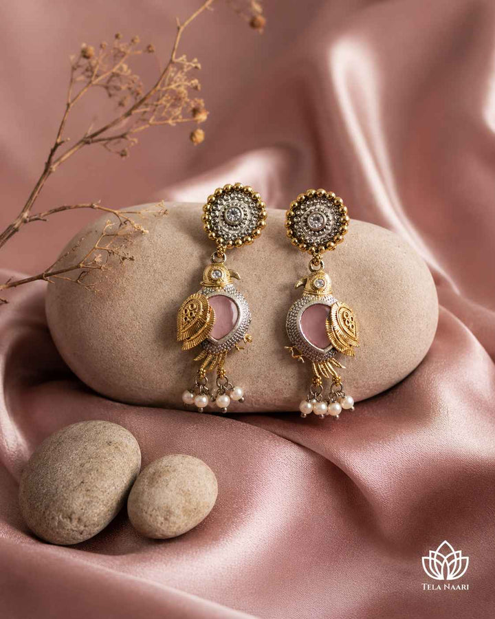 Dual-tone plating covers the surface of this bird earring.