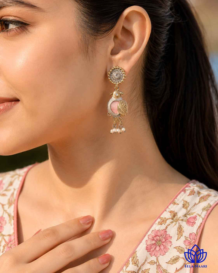 Textured surface combines dual-tone plating with pearl accents.