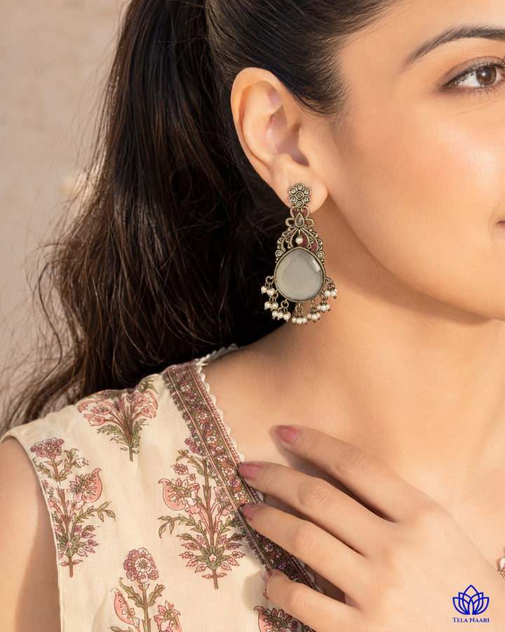 Post and back closure secures this silver-plated stone earring.