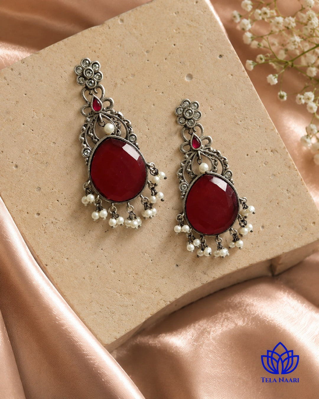 Silver-plated finish gives this earring a smooth, polished surface.