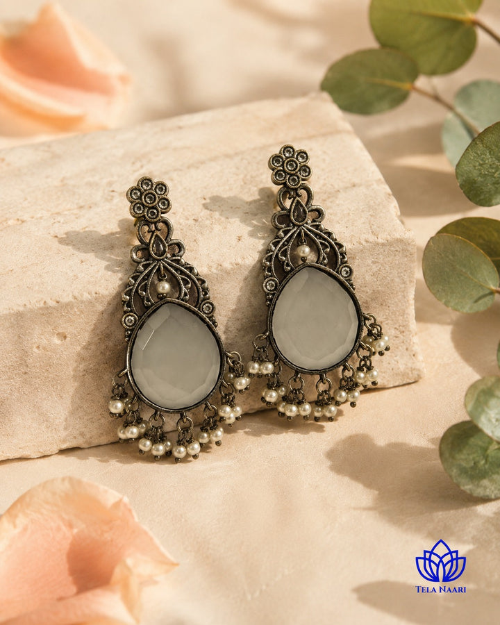Textured surface combines glass beads with silver-plated stone detailing.