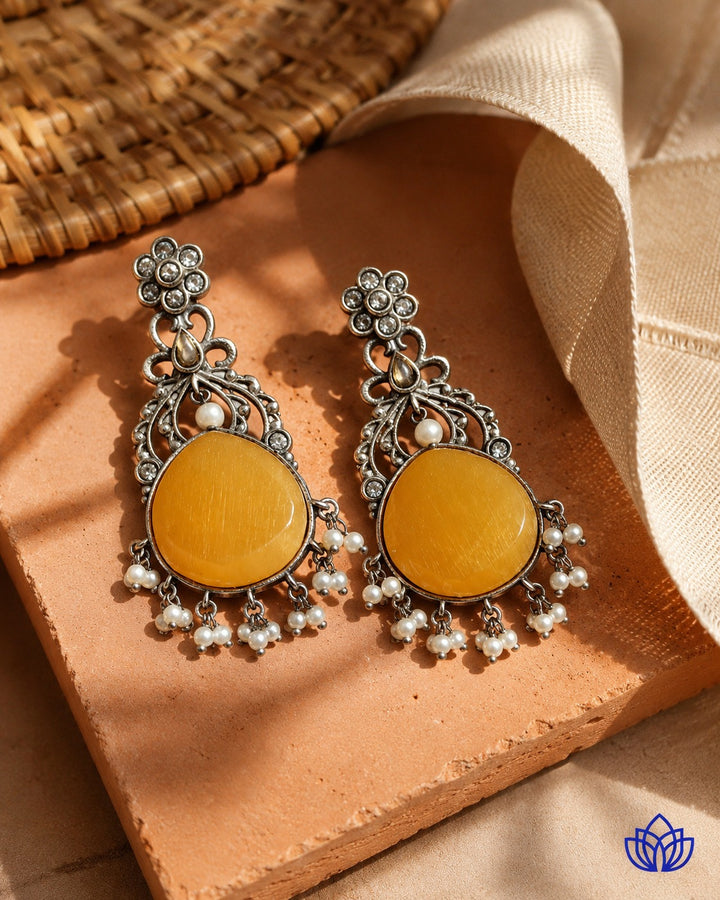 Textured surface combines glass beads with yellow stone detailing.