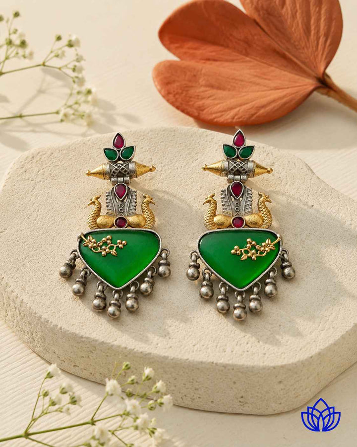 Brass construction supports the layered dual-tone plating of this earring.