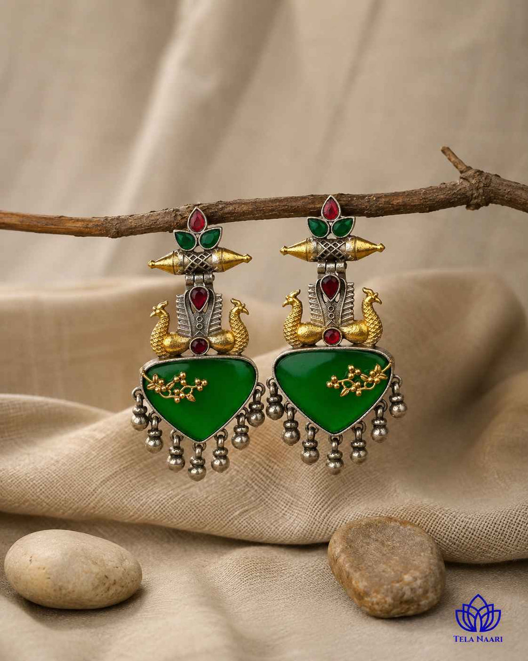 Layered dual-tone design gives this earring its bold structure.
