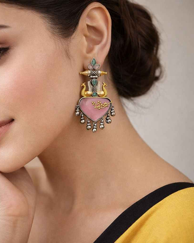 Weighted at 36g, this dual-tone earring balances a statement look with wearability.