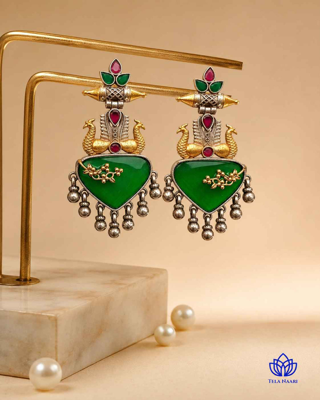 Bright green accents stand out against the silver-plated surface.