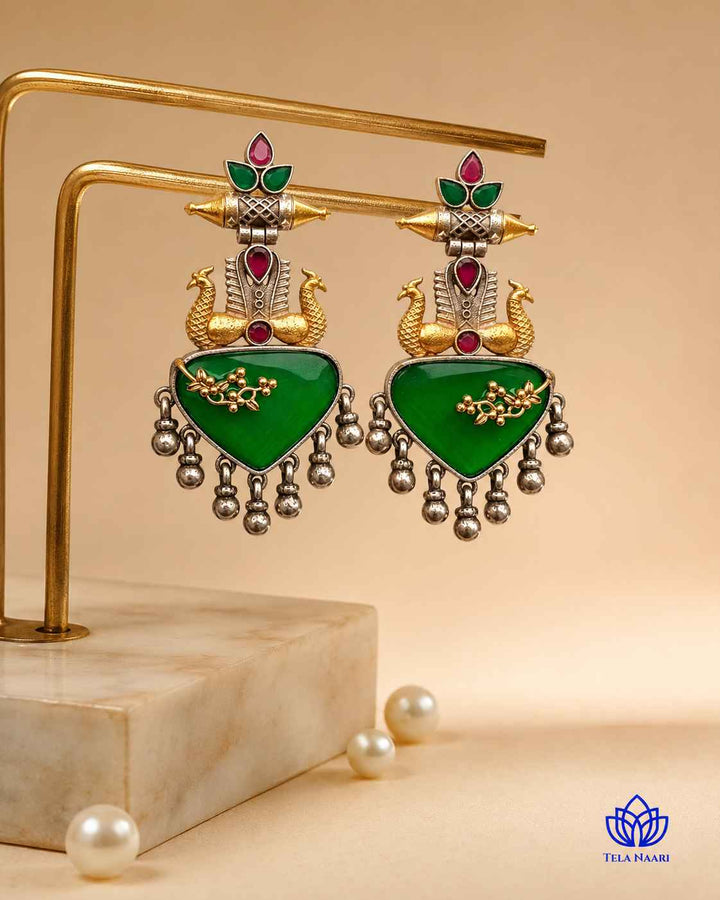 Bright green accents stand out against the silver-plated surface.