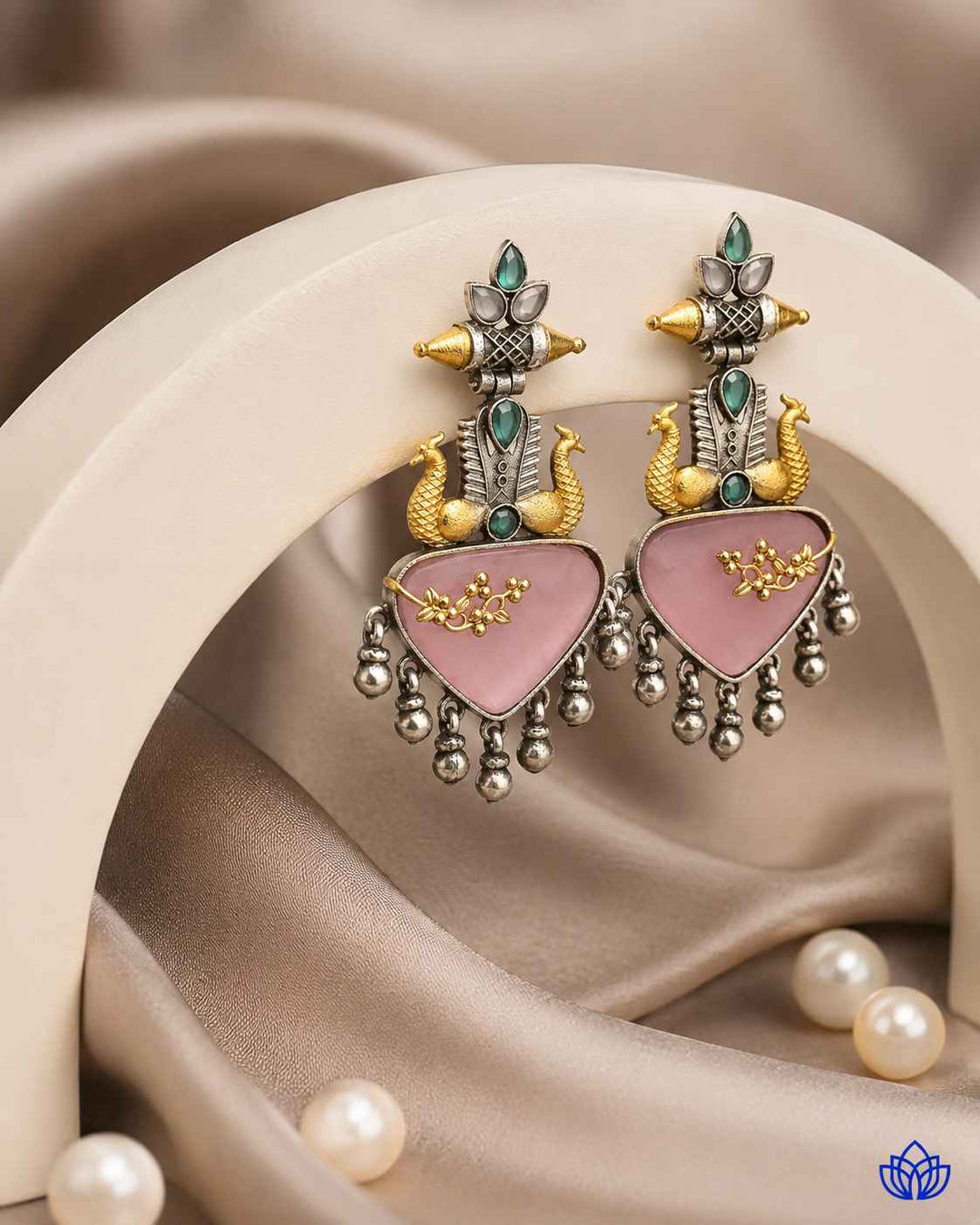 Pink and silver tones combine in this contemporary layered earring design.