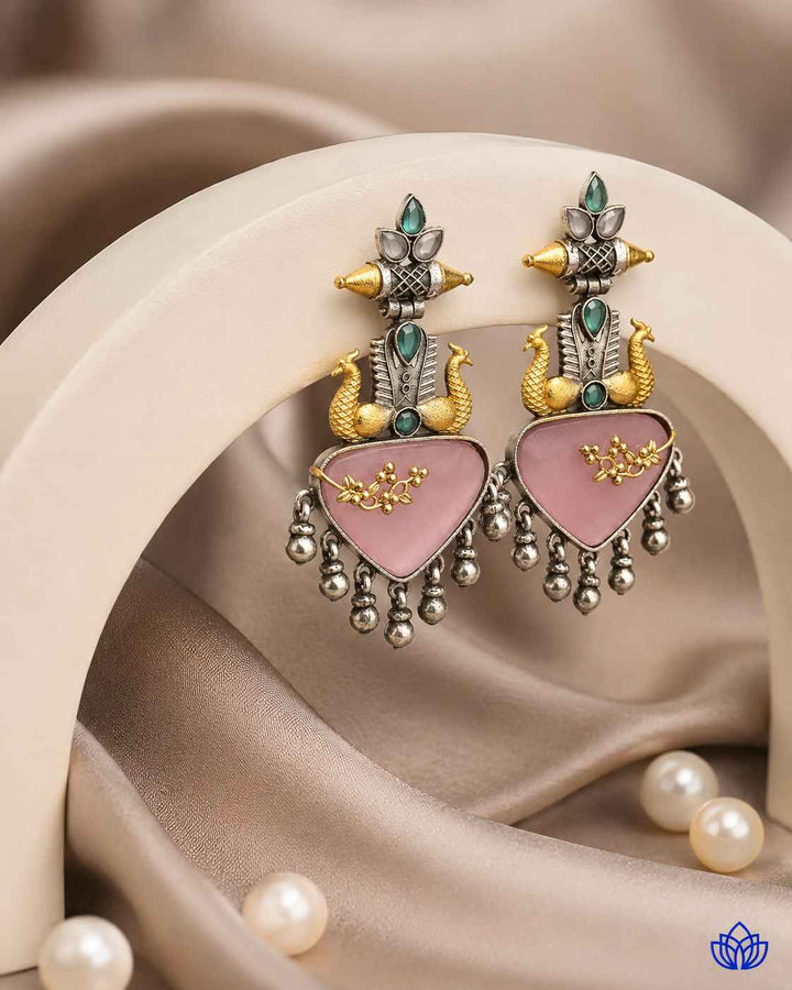 Pink and silver tones combine in this contemporary layered earring design.
