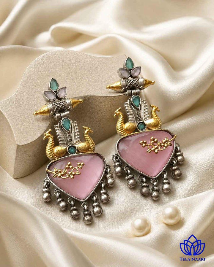 Contemporary dual-tone detailing highlights the interplay between silver shades and pink.