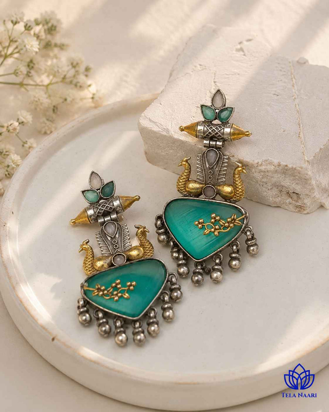 Brass construction supports the dual-tone plating of this earring.