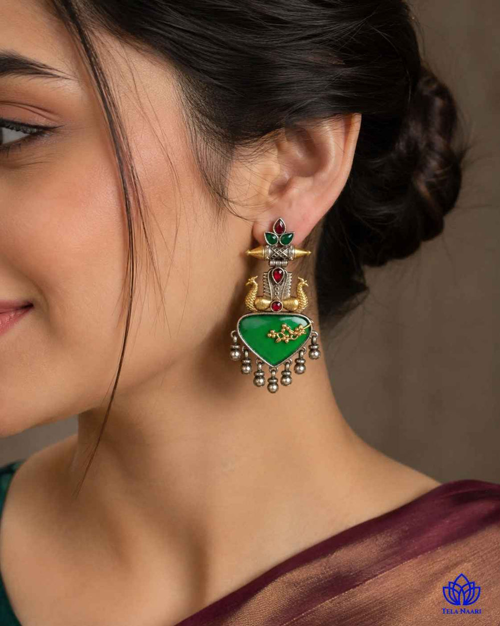 Silver-plated finish covers one half of this dual-tone earring design.