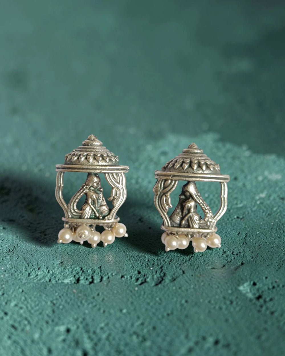 Brass construction supports the intricate temple craftsmanship of this earring.