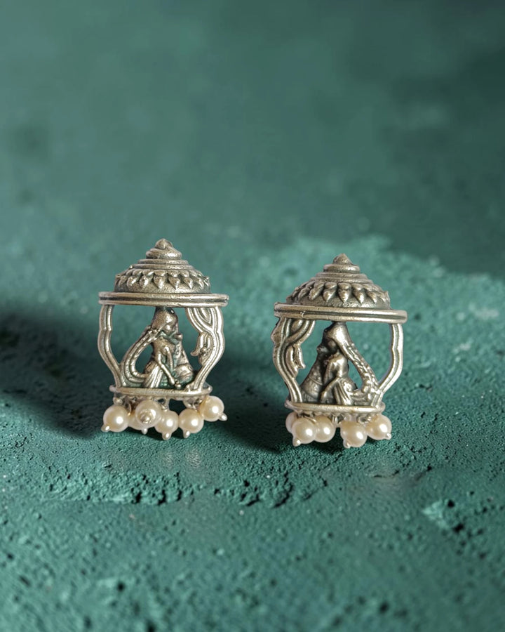 Brass construction supports the intricate temple craftsmanship of this earring.