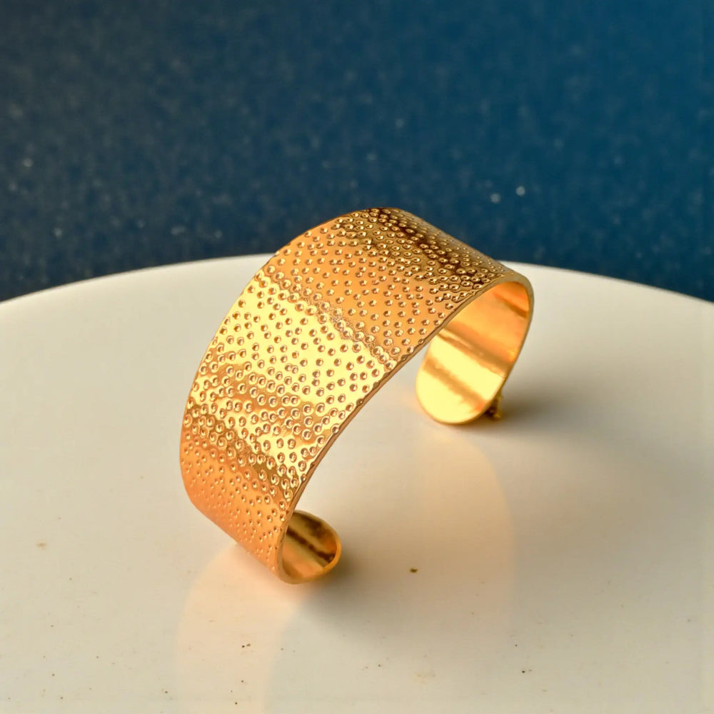 Anti-tarnish coating keeps this dotted cuff brilliant over time.