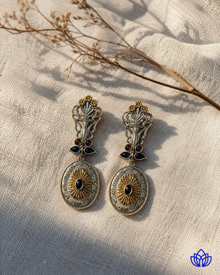 Handcrafted artistry defines the peacock motif of this earring.