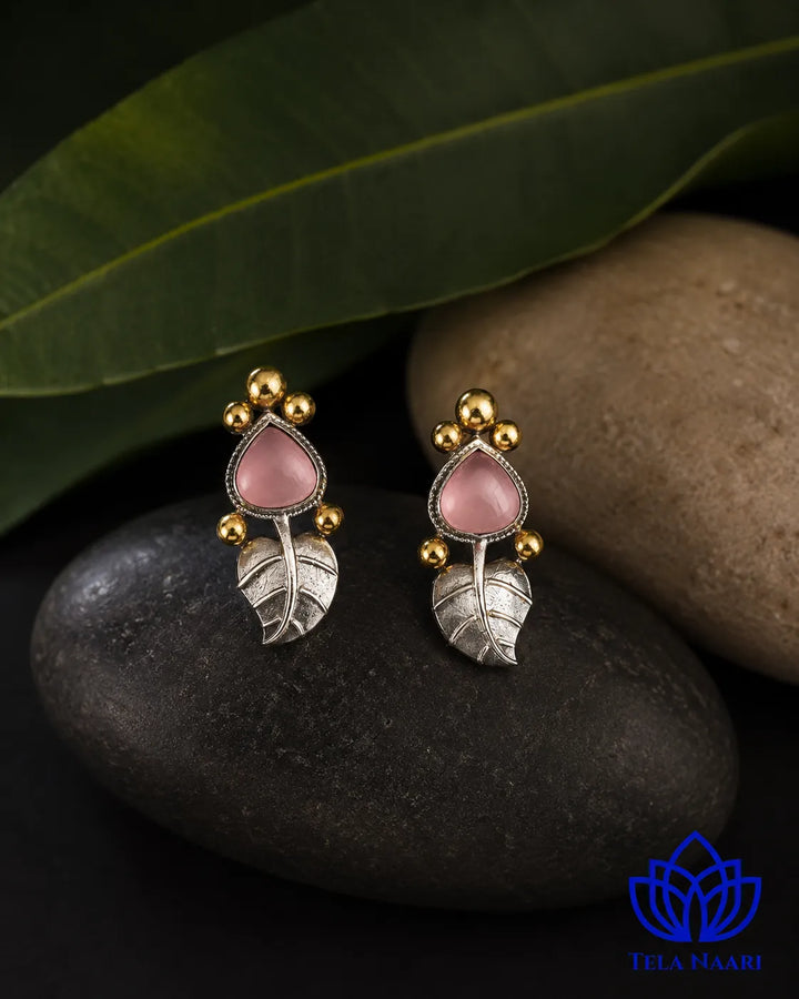 Contemporary silhouette pairs a leaf shape with dual-tone plating.