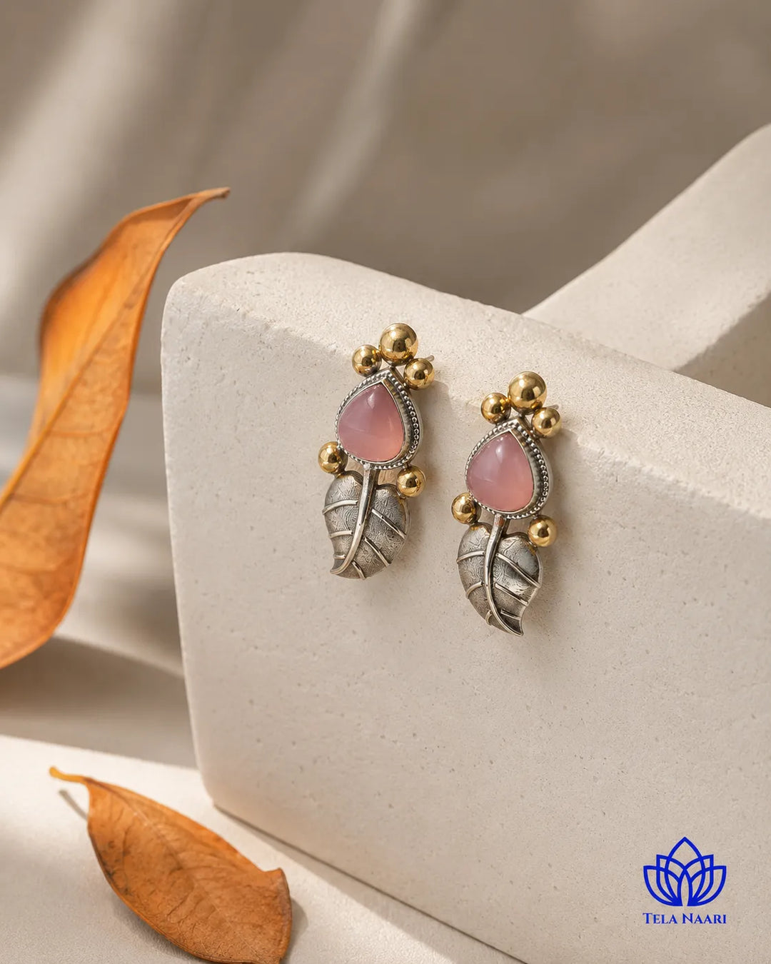 Delicate leaf shape defines the silhouette of this stud earring.