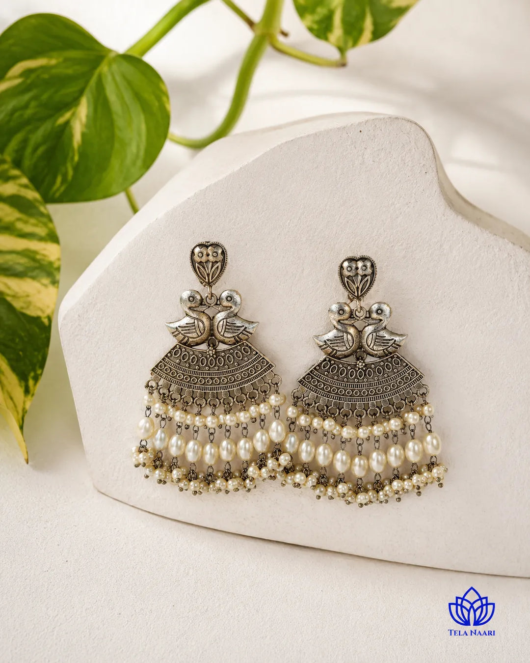 Whimsical design brings the duck motif to life in silver.