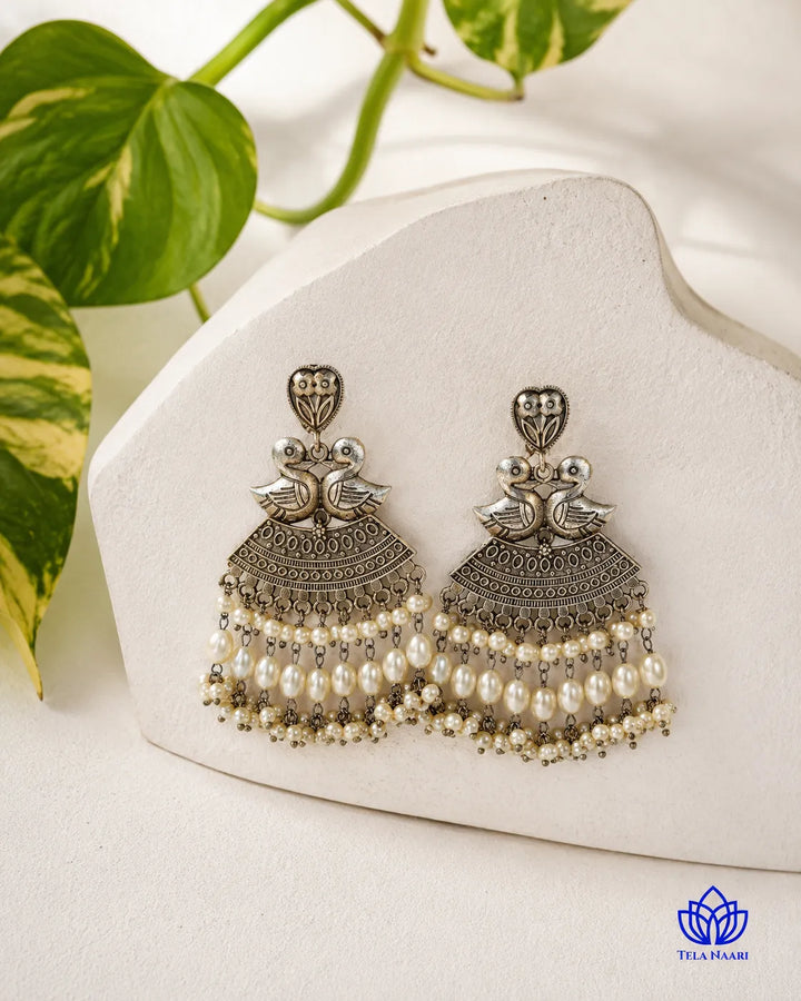 Whimsical design brings the duck motif to life in silver.