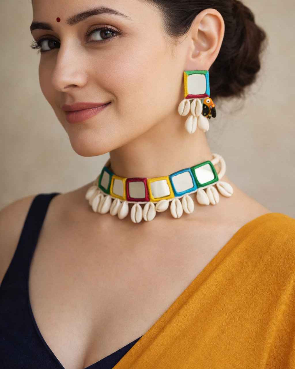 Intricate mirror embellishments decorate the surface of this choker.