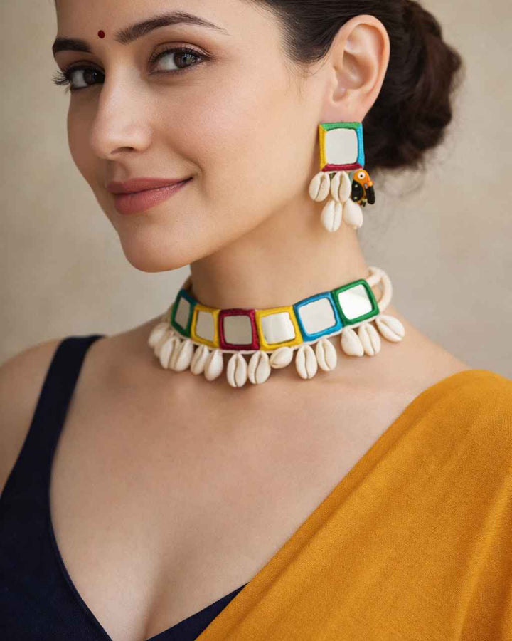 Intricate mirror embellishments decorate the surface of this choker.