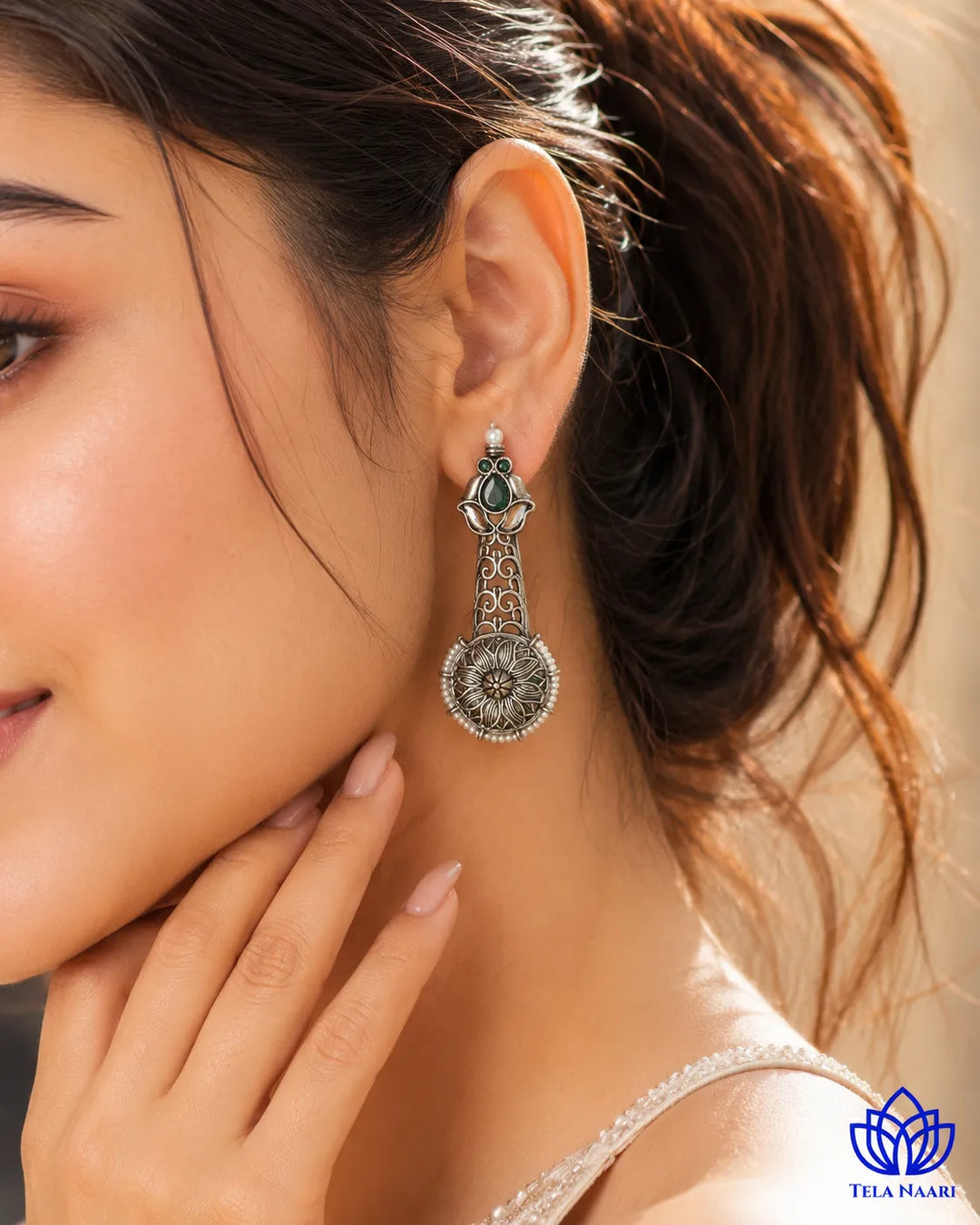 Brass construction supports the statement design of this earring.