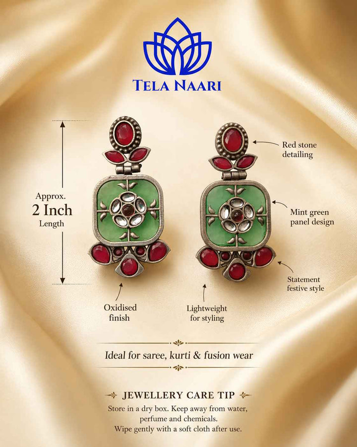 Silver-plated finish covers the free-moving silhouette of this earring.