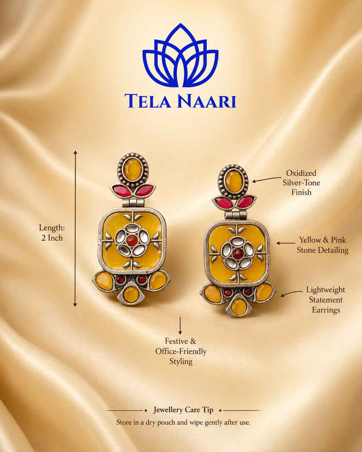 Indo-western looks gain effortless charm from this silver-plated dangler design.