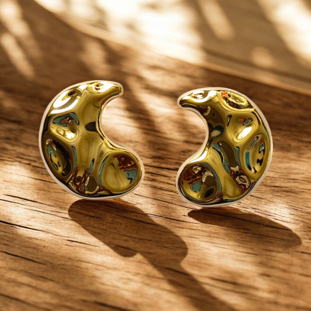 Polished surface highlights the tarnish-free finish of this earring.