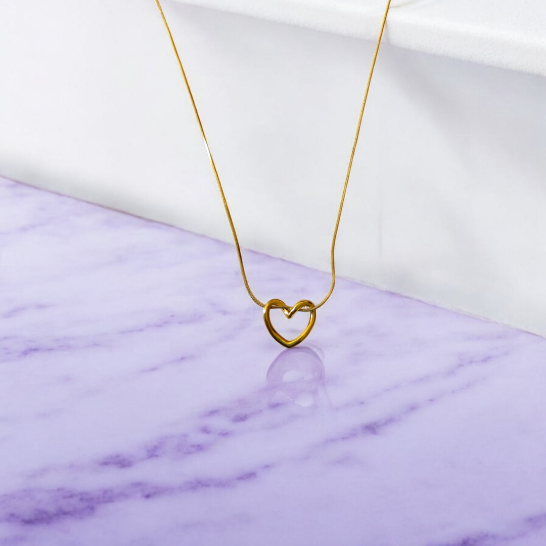 Gold-plated stainless steel gives this pendant necklace its polished shine.