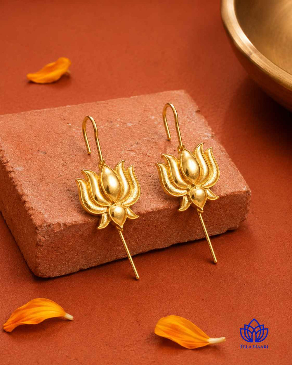 Plated surface catches the light across this lotus-motif earcuff.