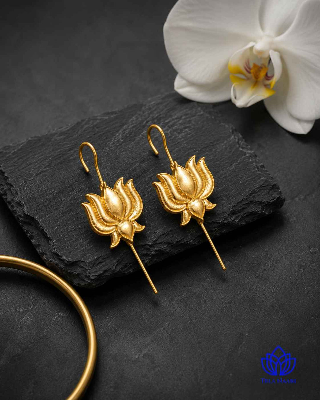 Timeless design pairs a lotus motif with gold-plated elegance.