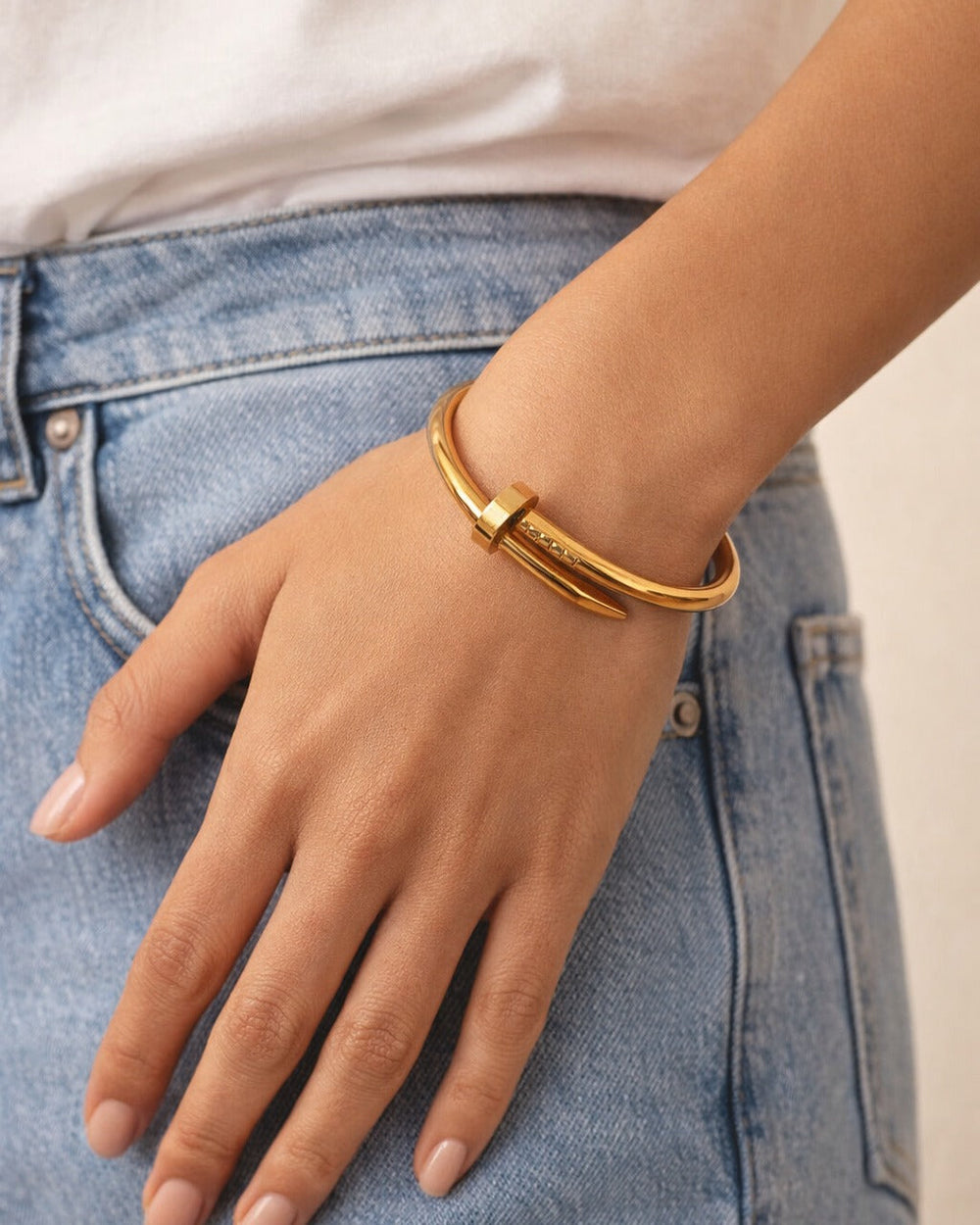 Gold-plated stainless steel gives this cuff bracelet its polished shine.
