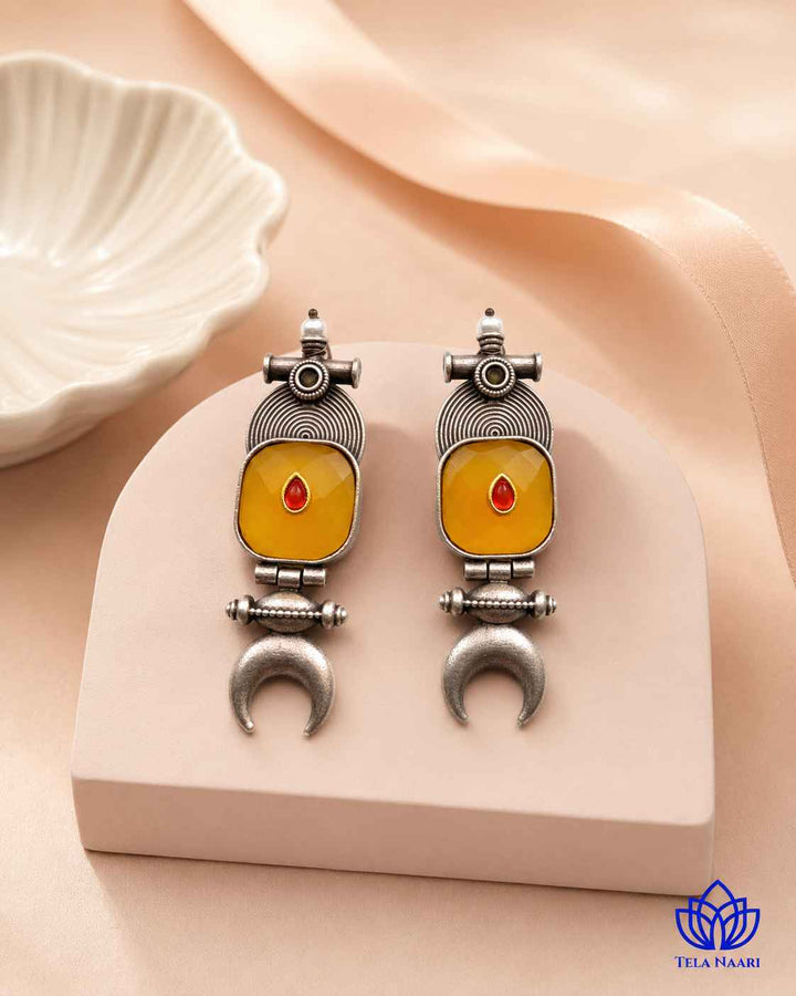 Timeless design pairs a half-moon silhouette with yellow accents.