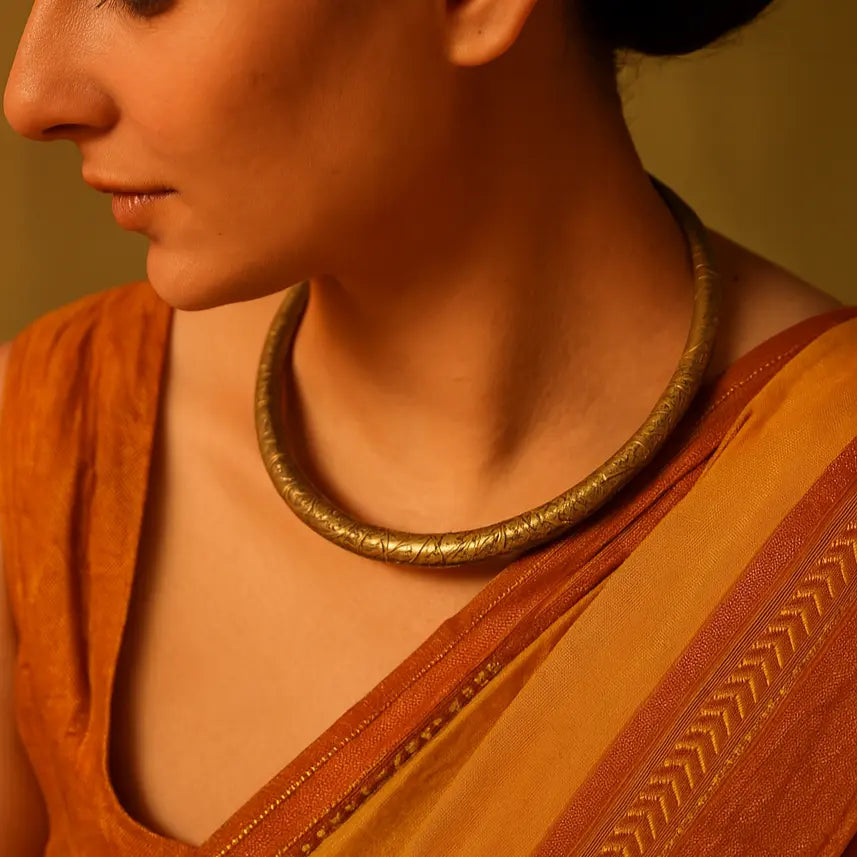 Handcrafted brass hasli necklace with spiral engraved pattern – luxury ethnic jewellery
