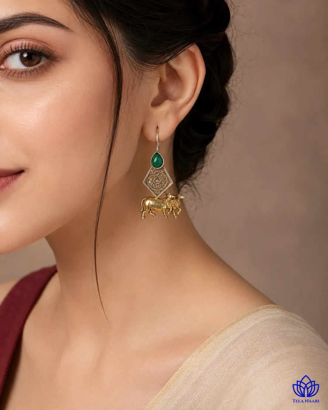 Delicate cow motif brings spiritual charm to this earring design.