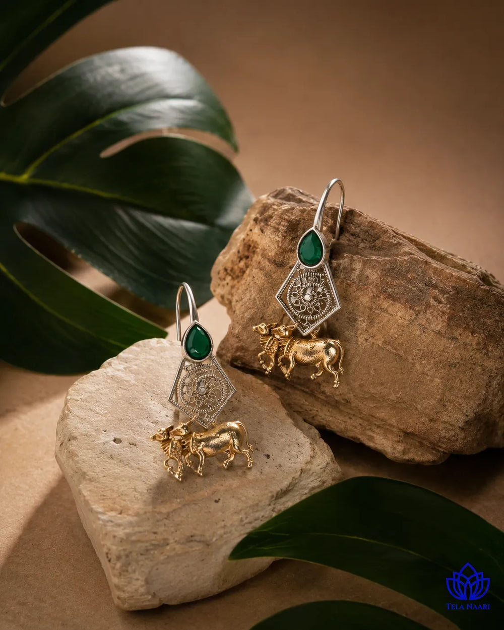 Gold-plated finish covers the surface of this cow motif earring.
