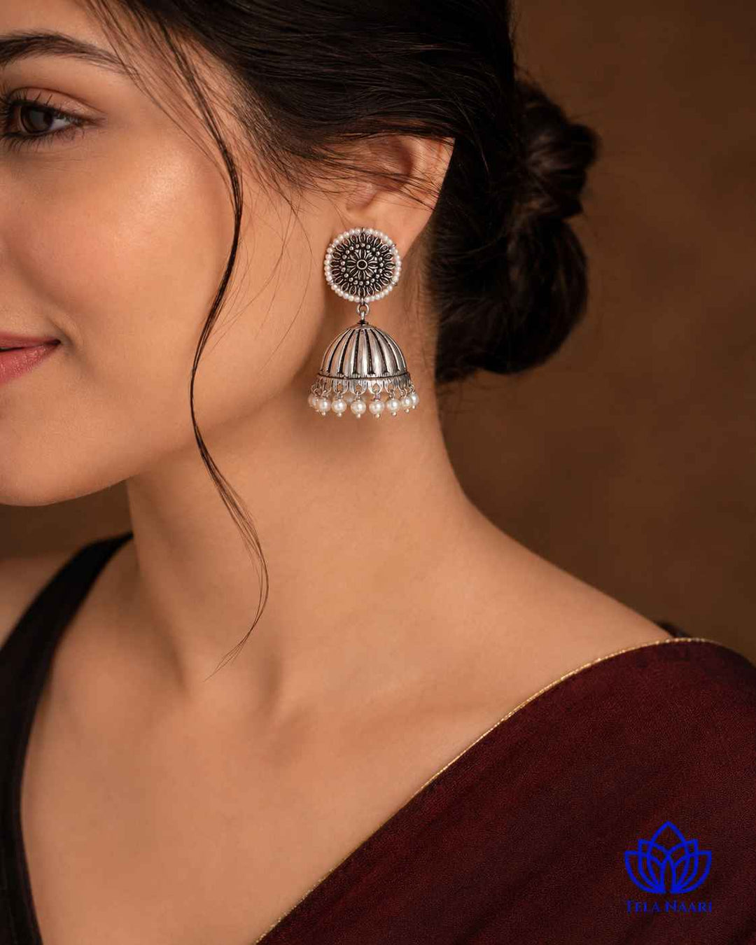 Antique detailing highlights the textured silver oxidised plating throughout.