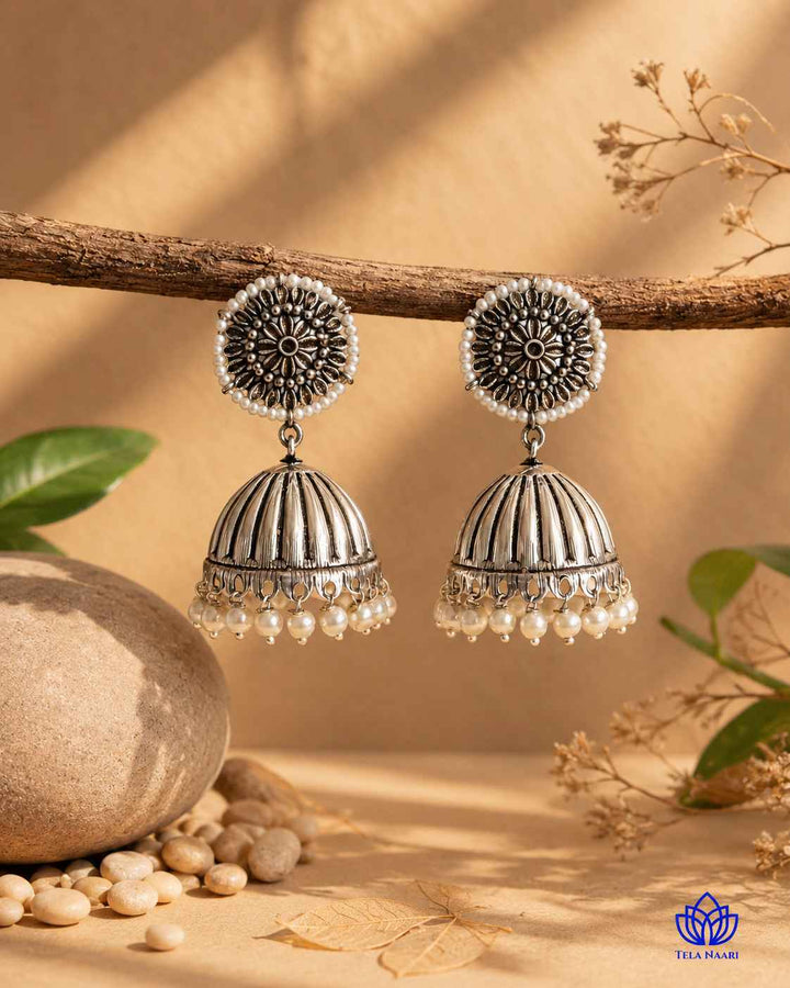 Glass beads sit within the antique silver oxidised earring design.